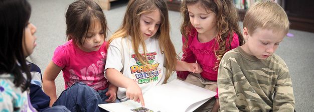 children reading a book