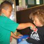 children listening to heart