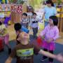 children dancing with scarves